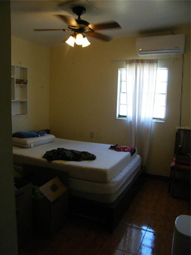 bedroom with a wall mounted air conditioner and ceiling fan