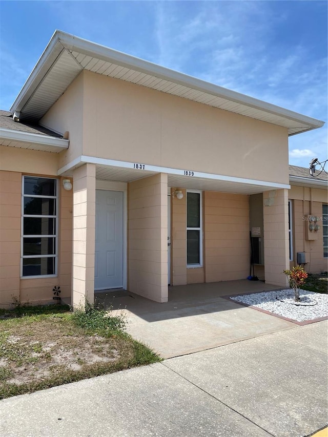 1837 Club Cir Unit 1837, Lakeshore, FL 33854 - view of front of property featuring concrete block siding and roof with shingles