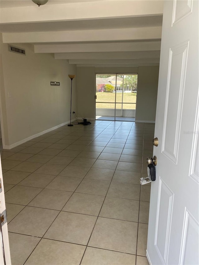 1837 Club Cir Unit 1837, Lakeshore, FL 33854 - interior space featuring light tile patterned flooring, baseboards, visible vents, and beam ceiling