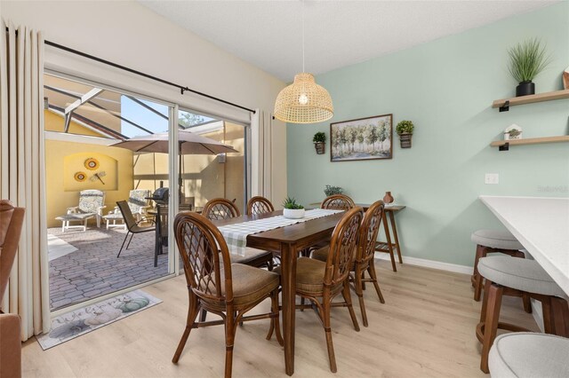 4722 Flagler Beach Way, Kissimmee, FL 34746 - dining space with baseboards and light wood-type flooring