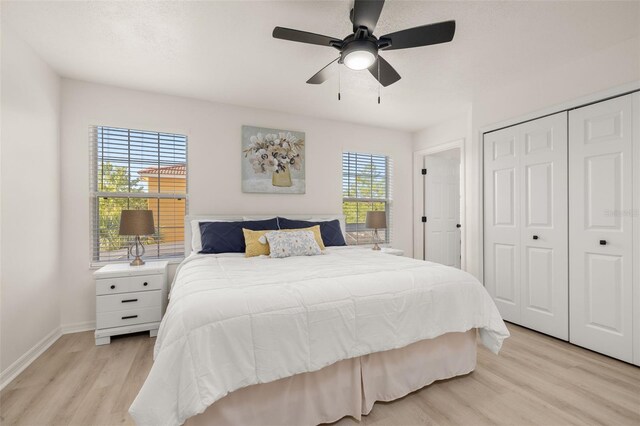 4722 Flagler Beach Way, Kissimmee, FL 34746 - bedroom featuring baseboards, ceiling fan, light wood-style floors, and a closet