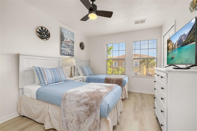 4722 Flagler Beach Way, Kissimmee, FL 34746 - bedroom with a ceiling fan, visible vents, baseboards, and light wood-type flooring
