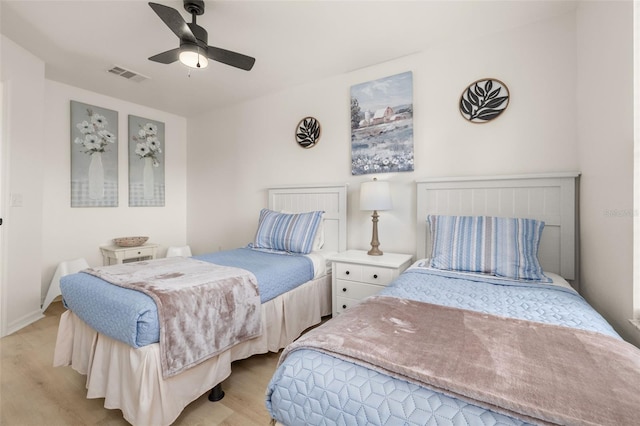 4722 Flagler Beach Way, Kissimmee, FL 34746 - bedroom with visible vents, ceiling fan, and light wood-type flooring