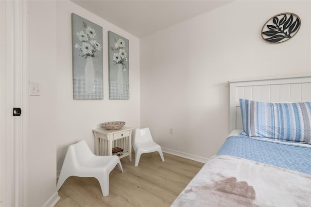 4722 Flagler Beach Way, Kissimmee, FL 34746 - bedroom with baseboards and light wood-style floors