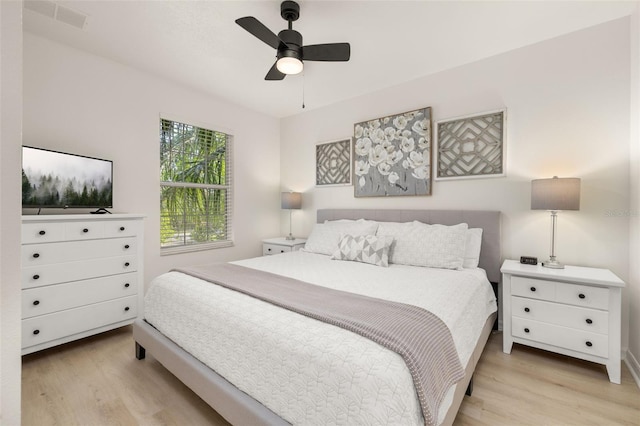 4722 Flagler Beach Way, Kissimmee, FL 34746 - bedroom featuring visible vents, ceiling fan, and light wood-style flooring