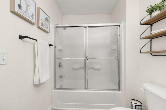 4722 Flagler Beach Way, Kissimmee, FL 34746 - bathroom featuring bath / shower combo with glass door and toilet