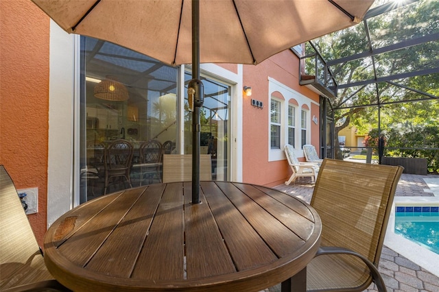4722 Flagler Beach Way, Kissimmee, FL 34746 - exterior space with glass enclosure, outdoor dining space, an outdoor pool, and a patio area
