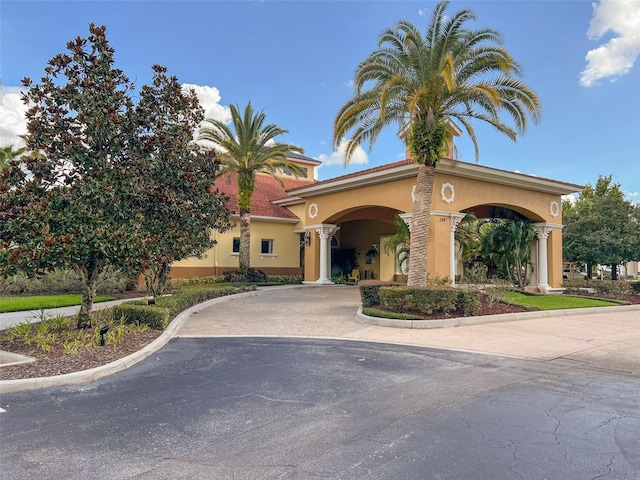 4722 Flagler Beach Way, Kissimmee, FL 34746 - view of front of property with curved driveway and stucco siding