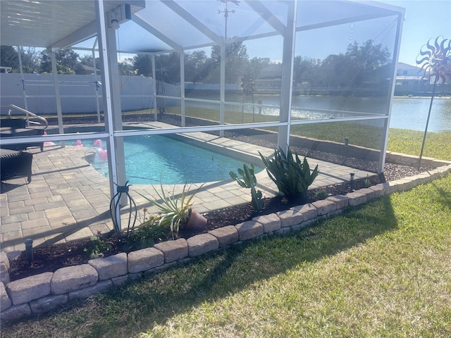 view of pool with fence, a patio, a fenced in pool, a water view, and glass enclosure