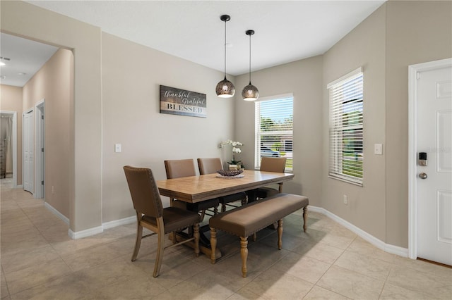 13475 Crest Lake Dr, Hudson, FL 34669 - dining area with baseboards and light tile patterned flooring