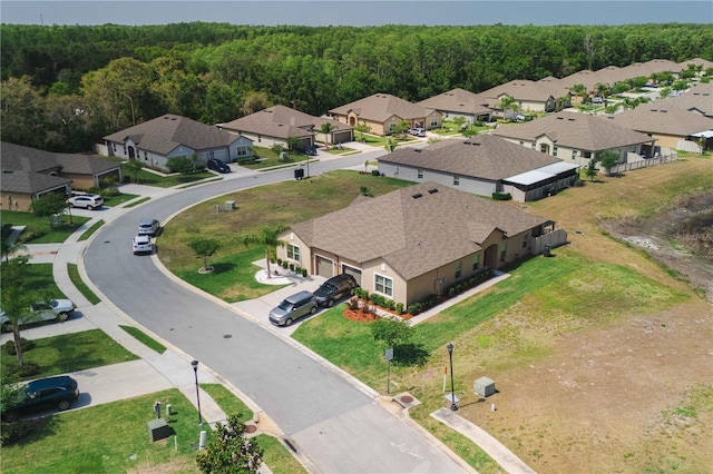 13475 Crest Lake Dr, Hudson, FL 34669 - drone / aerial view with a residential view and a forest view