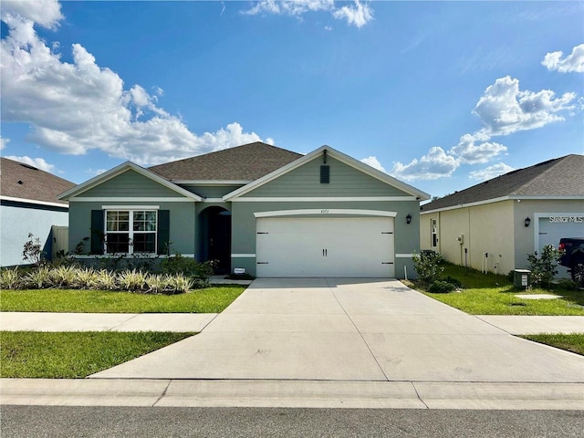 4373 Deleon St, Haines City, FL 33844 - ranch-style home with stucco siding, driveway, a front lawn, and a garage