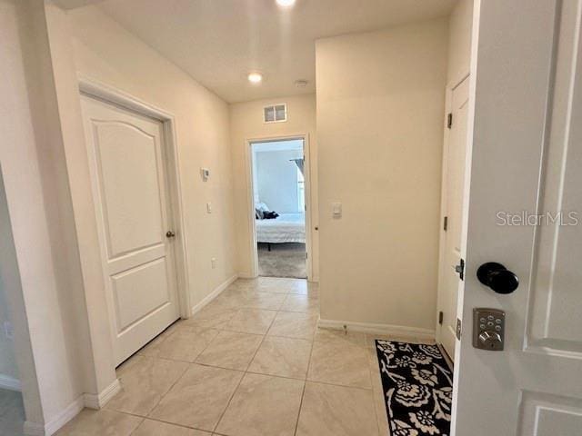 4373 Deleon St, Haines City, FL 33844 - corridor with recessed lighting, baseboards, visible vents, and light tile patterned floors