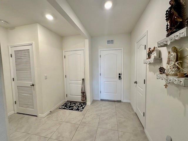 4373 Deleon St, Haines City, FL 33844 - interior space with light tile patterned flooring, baseboards, visible vents, and recessed lighting