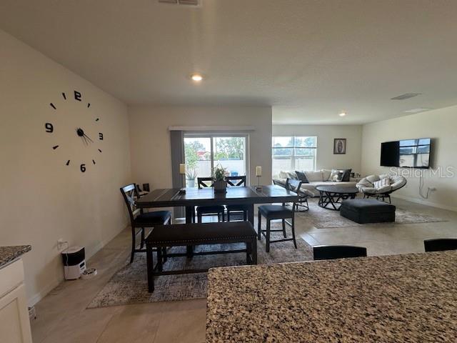 4373 Deleon St, Haines City, FL 33844 - dining area with recessed lighting and baseboards