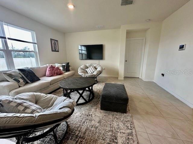 4373 Deleon St, Haines City, FL 33844 - living area with light tile patterned floors, baseboards, and visible vents