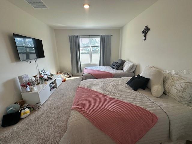 4373 Deleon St, Haines City, FL 33844 - carpeted bedroom featuring visible vents