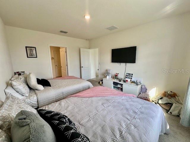 4373 Deleon St, Haines City, FL 33844 - carpeted bedroom featuring visible vents