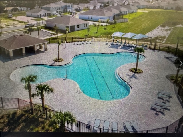 4373 Deleon St, Haines City, FL 33844 - pool with a patio, fence, and a residential view