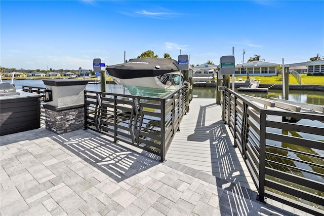 dock area featuring a water view and boat lift
