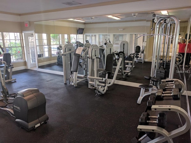 gym with baseboards and visible vents