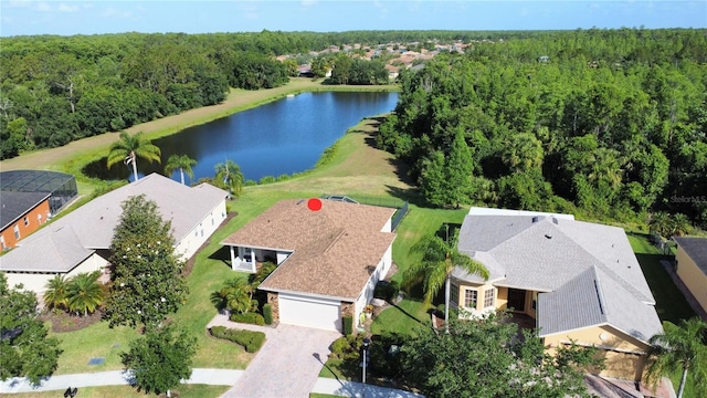 bird's eye view with a view of trees and a water view