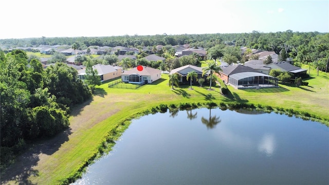 birds eye view of property with a water view and a residential view