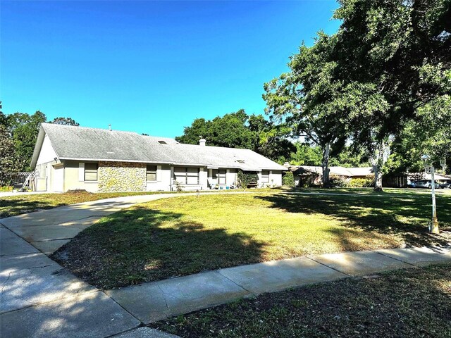 3328 Wax Berry Ct, Windermere, FL 34786 - ranch-style house featuring stucco siding and a front yard
