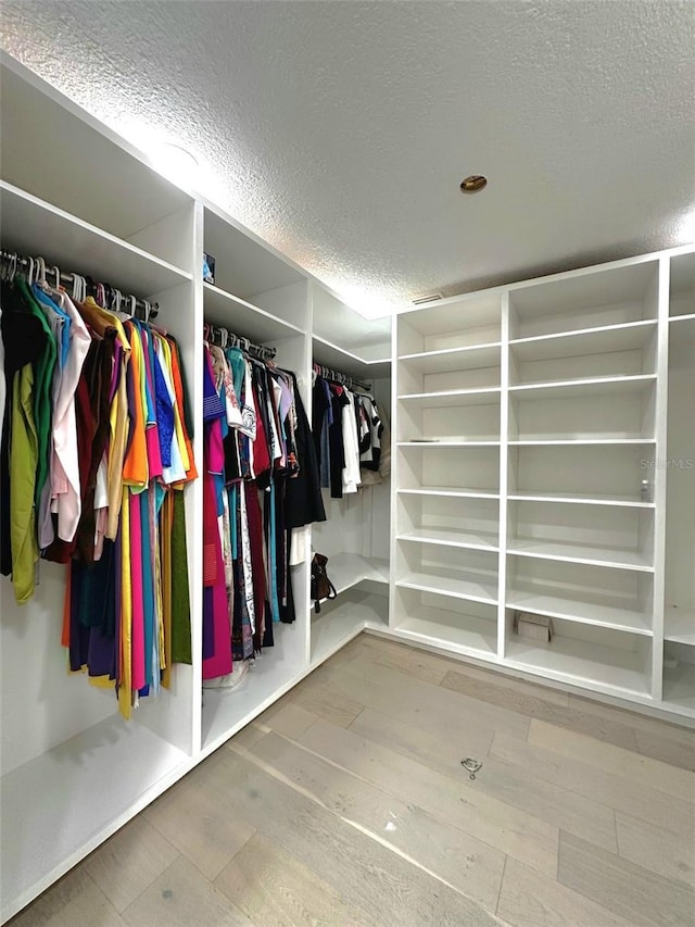 3328 Wax Berry Ct, Windermere, FL 34786 - walk in closet featuring hardwood / wood-style floors