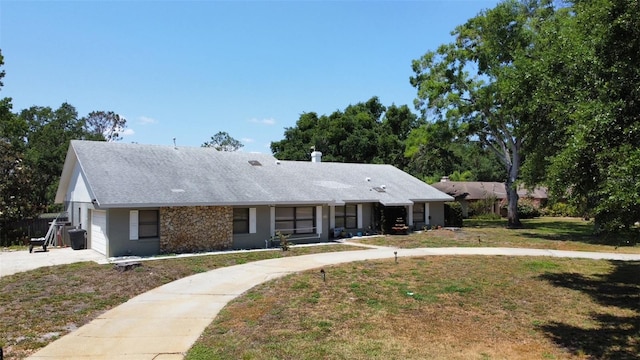 3328 Wax Berry Ct, Windermere, FL 34786 - ranch-style home with an attached garage, driveway, and a front lawn