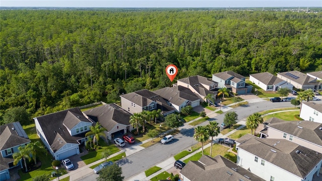 aerial view featuring a residential view and a view of trees