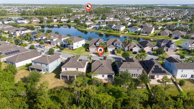 aerial view with a water view and a residential view