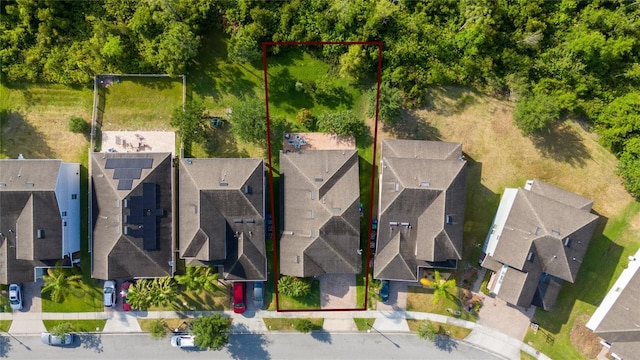 birds eye view of property with a residential view