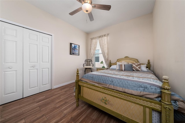 bedroom with a closet, baseboards, ceiling fan, and wood finished floors