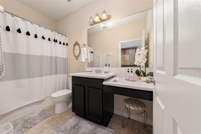 full bathroom with tile patterned floors, shower / bath combo, vanity, and toilet