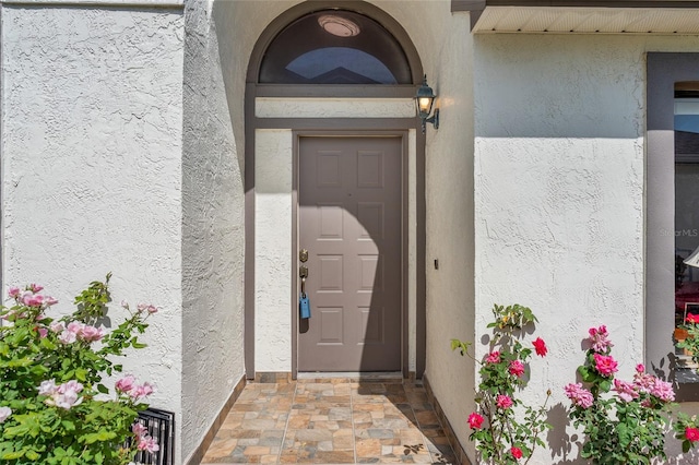 98 Lakepointe Cir, Kissimmee, FL 34743 - property entrance with stucco siding