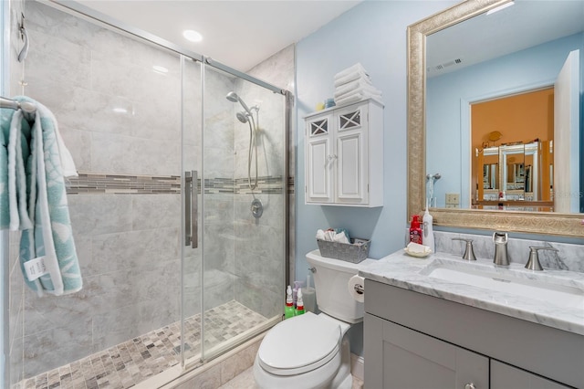 98 Lakepointe Cir, Kissimmee, FL 34743 - full bathroom featuring toilet, visible vents, a shower stall, and vanity
