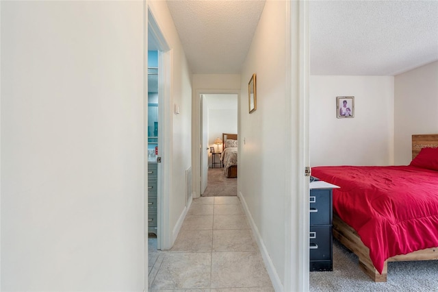 98 Lakepointe Cir, Kissimmee, FL 34743 - hall with a textured ceiling, light tile patterned floors, and baseboards