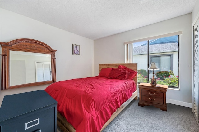 98 Lakepointe Cir, Kissimmee, FL 34743 - carpeted bedroom featuring a textured ceiling and baseboards