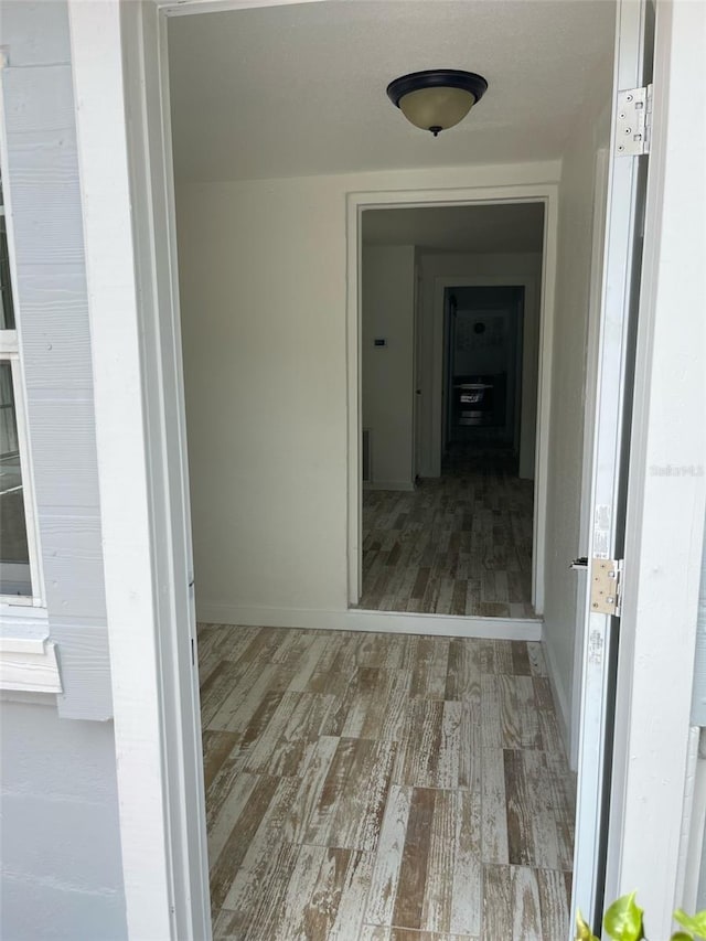 hallway featuring wood finished floors