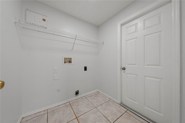 clothes washing area with washer hookup, hookup for an electric dryer, laundry area, light tile patterned floors, and baseboards