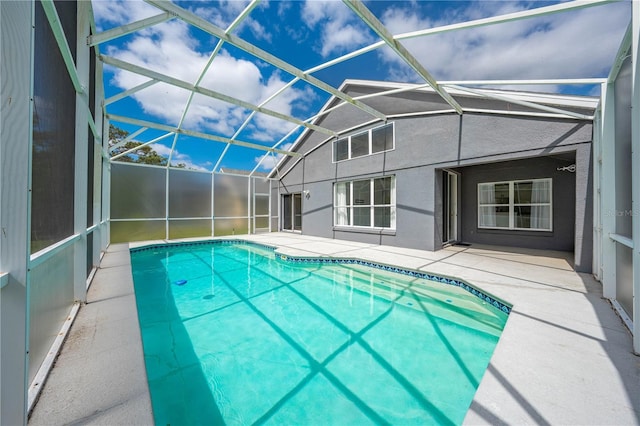outdoor pool featuring a patio and a lanai