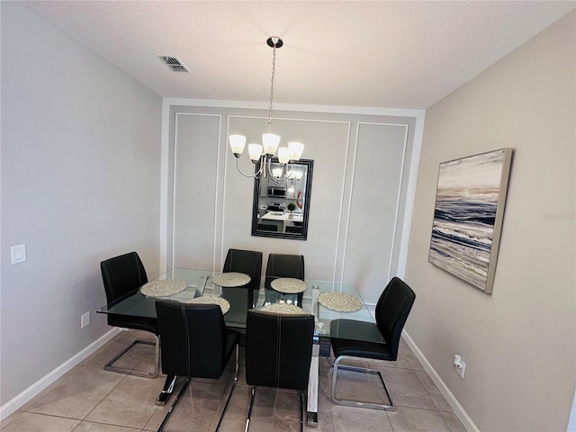 1321 Yorkdale Rd, Davenport, FL 33837 - dining room featuring visible vents, baseboards, tile patterned floors, and an inviting chandelier