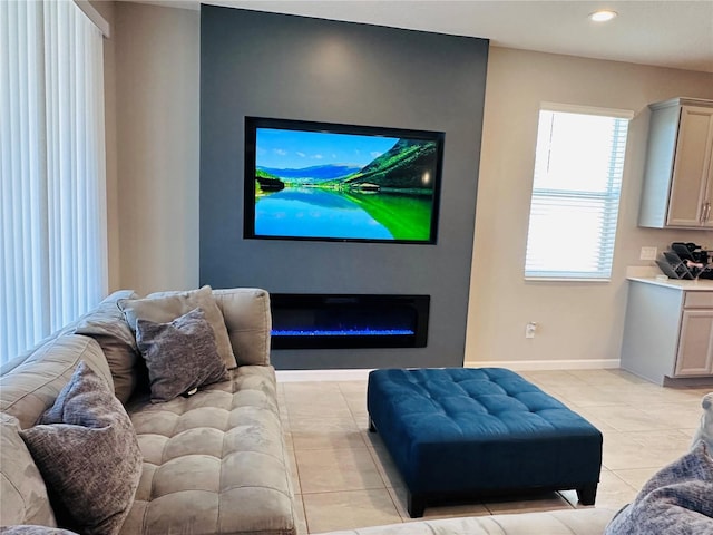 1321 Yorkdale Rd, Davenport, FL 33837 - living area with recessed lighting, baseboards, a glass covered fireplace, and light tile patterned floors
