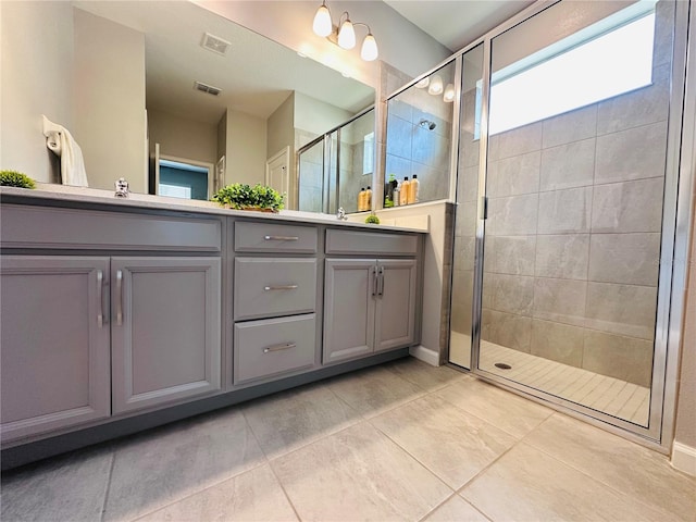 1321 Yorkdale Rd, Davenport, FL 33837 - full bath featuring double vanity, tile patterned flooring, a shower stall, and visible vents