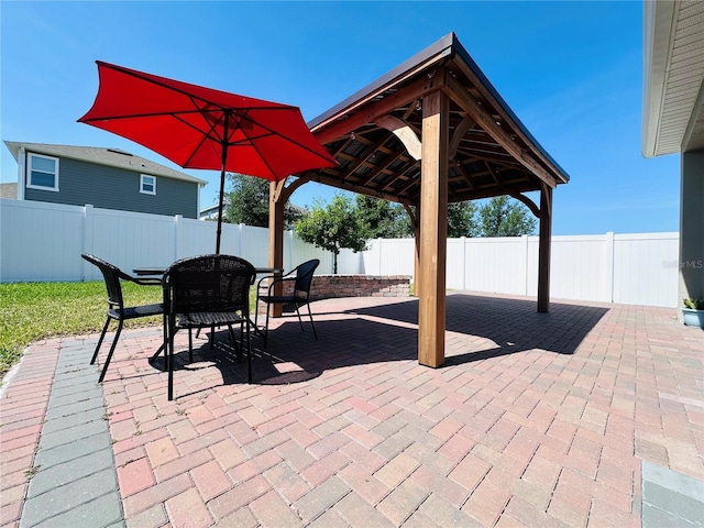 1321 Yorkdale Rd, Davenport, FL 33837 - view of patio featuring a fenced backyard, outdoor dining space, and a gazebo