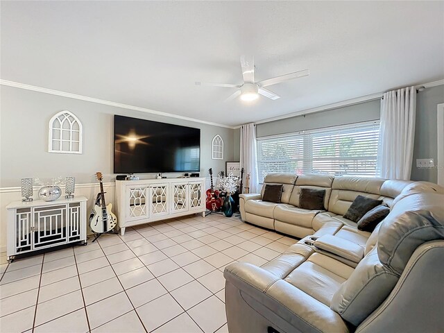 living area featuring ornamental molding, a ceiling fan, and light tile patterned floors