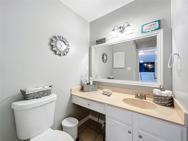 half bath featuring vanity, tile patterned flooring, and toilet