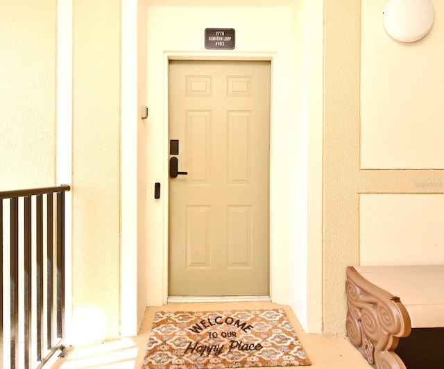 2778 Almaton Loop Unit 403, Kissimmee, FL 34747 - doorway to property with stucco siding