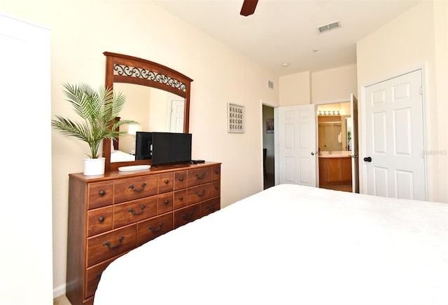 2778 Almaton Loop Unit 403, Kissimmee, FL 34747 - bedroom with connected bathroom, ceiling fan, and visible vents